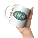 BWIA_Vintage_Bag_Sticker_Coffee_Mug_-_11_11oz_White_LH_Model_Mockup.png_15767918