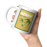 Ozark_Airlines_-_Yellow__Green_Logo_Cof_11oz_White_LH_Model_Mockup.png