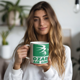 Ozark_Airlines_Green_Logo_Coffee_Mug_Model_Holding_LH_Mockup.png