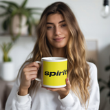 Spirit_Airlines_-_Black_on_Yellow_Coffee_Model_Holding_LH_Mockup.png_15644480