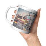 Ticket_To_Berlin_Collage_Art_Coffee_Mug__11oz_White_LH_Model_Mockup.png_15944232
